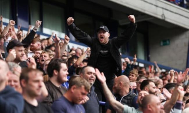 Wigan Athletic fans cheering on their team